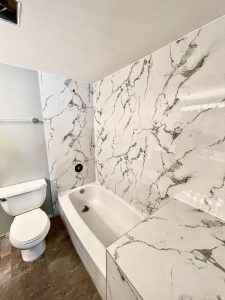 shite marble with side wall and tub renovation