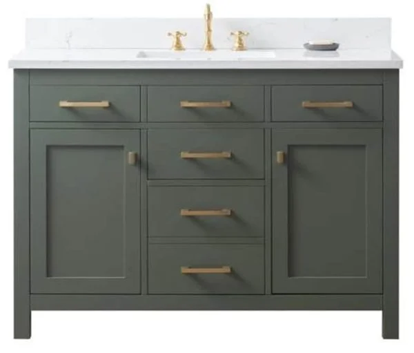 green shaker style bathroom vanity with gold handles and a white countertop.