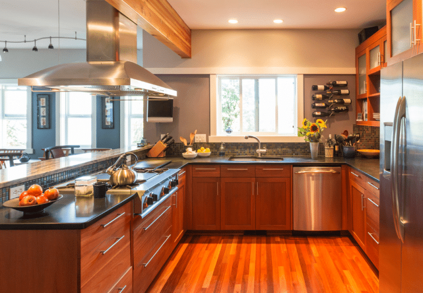 Modern kitchen interior after business remodeling with stainless steel appliances.