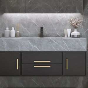 Modern bathroom with a dark floating vanity, gray marble countertop, and gold handles.