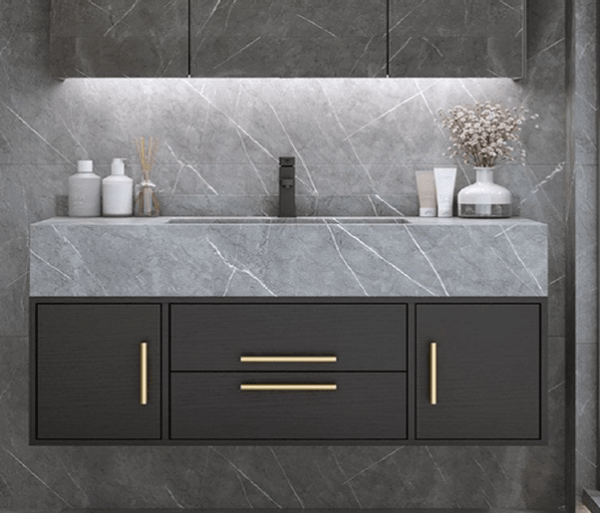 modern bathroom with a dark floating vanity, gray marble countertop, and gold handles.