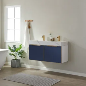 Modern bathroom with a floating vanity featuring a granite double sink top and blue cabinetry.