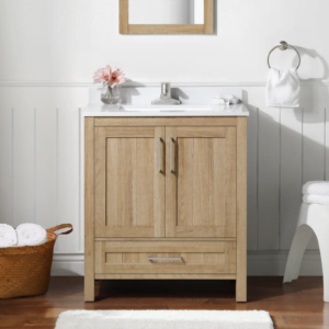 A single sink bathroom vanity made of oak wood, featuring a simple design with storage drawers and a cabinet, placed in a bright, minimalist bathroom.