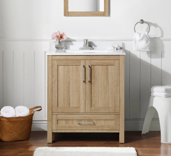 a single sink bathroom vanity made of oak wood, featuring a simple design with storage drawers and a cabinet, placed in a bright, minimalist bathroom.