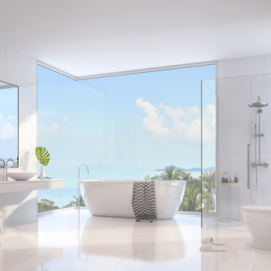 Modern bathroom with ocean view and freestanding tub during a bathroom renovation in North Vancouver.