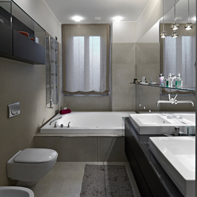 Modern condo bathroom with double sinks, large tub, and neutral color tones.