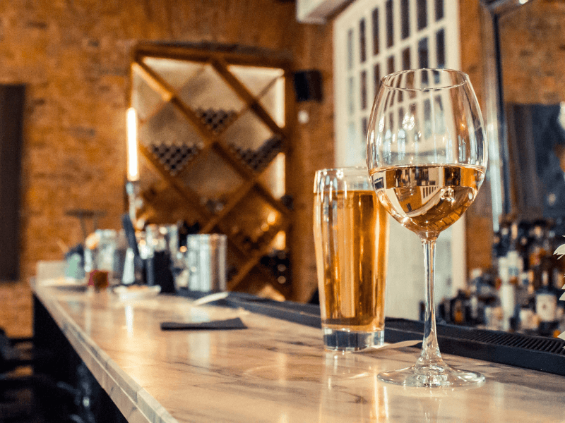 Countertop restaurant renovation with wine and beer glasses on a sleek bar.