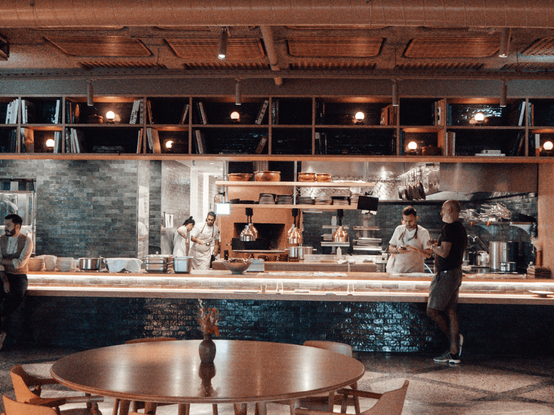 Restaurant renovation in Vancouver with open kitchen design and modern decor.