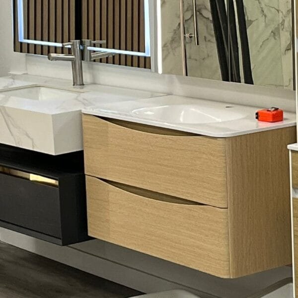 23-inch Al Oak floating bathroom vanity with curved soft-close drawers and an integrated sink.