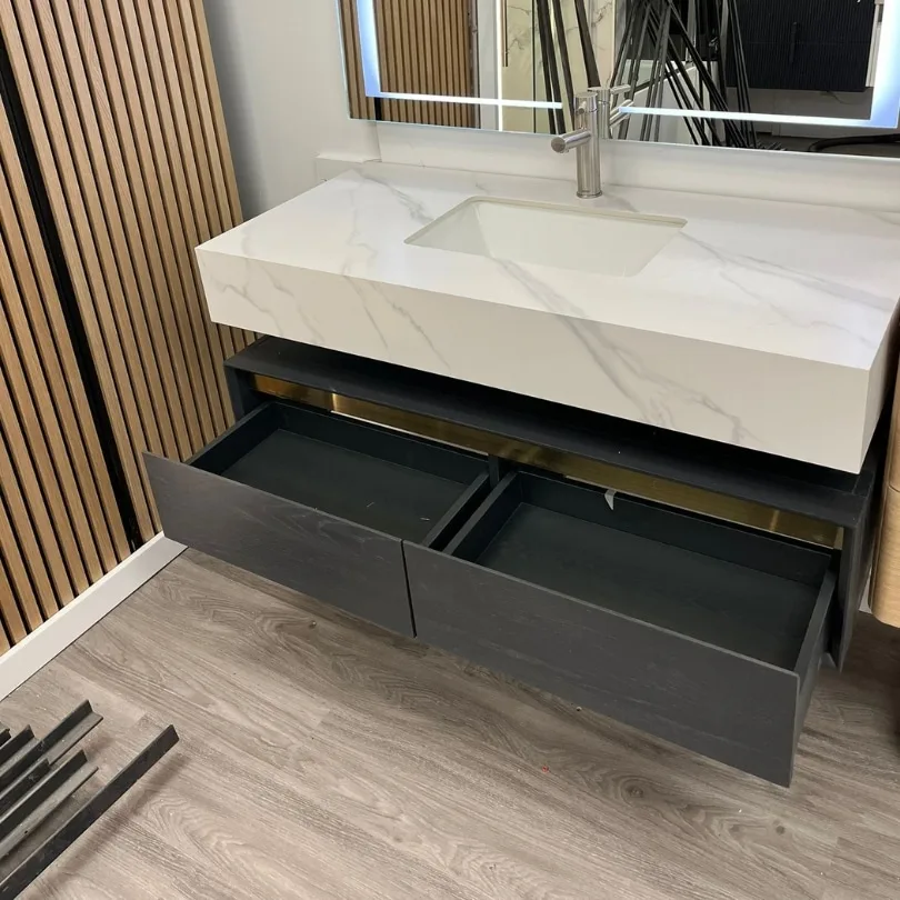 47-inch floating vanity with a marble countertop, open soft-close drawers, and a modern LED mirror.