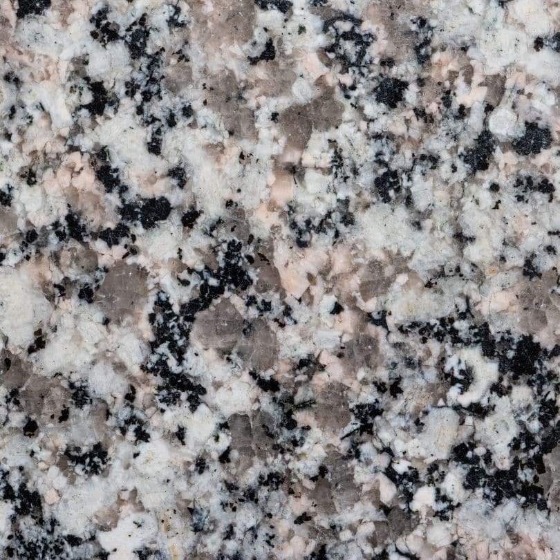 Close-up of a granite countertop surface with natural patterns and textures.