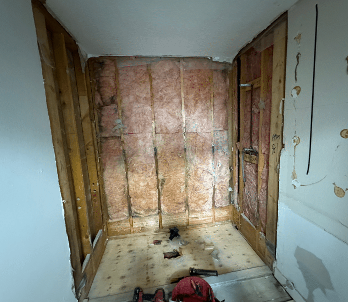 demolition process of a bathroom during a step-by-step remodel