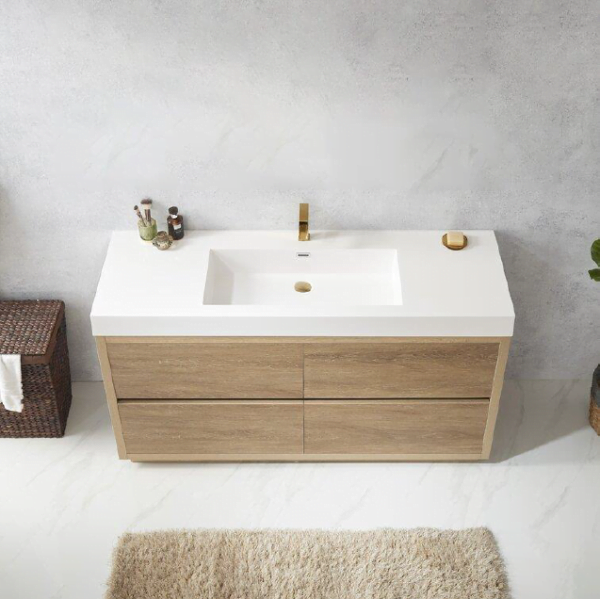 top view of a modern freestanding bathroom cabinet with a wood finish and white countertop, featuring a gold faucet.