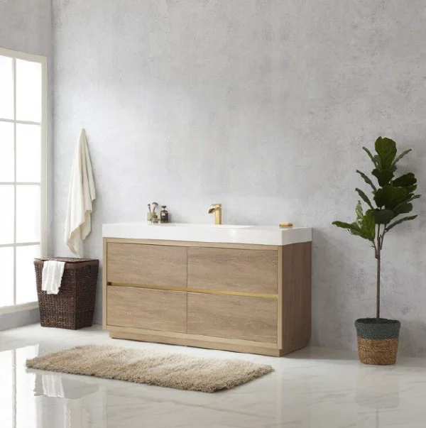 Modern bathroom with a freestanding wood-finish vanity cabinet, white countertop, and gold accents.