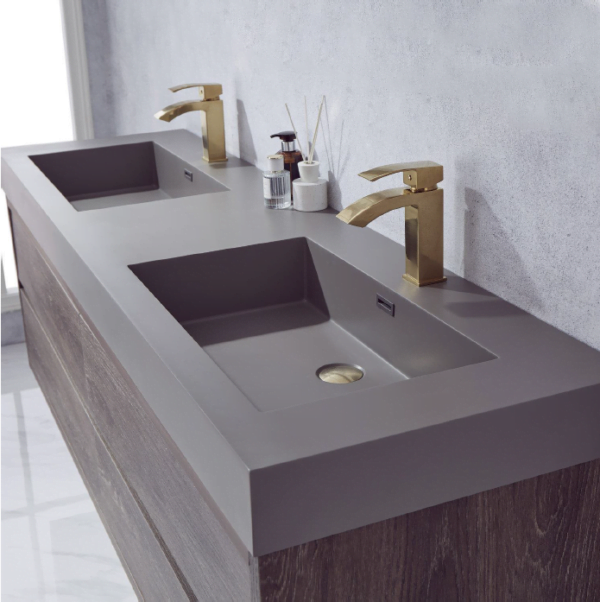 close-up of double floating bathroom vanity with dual sinks and gold faucets.