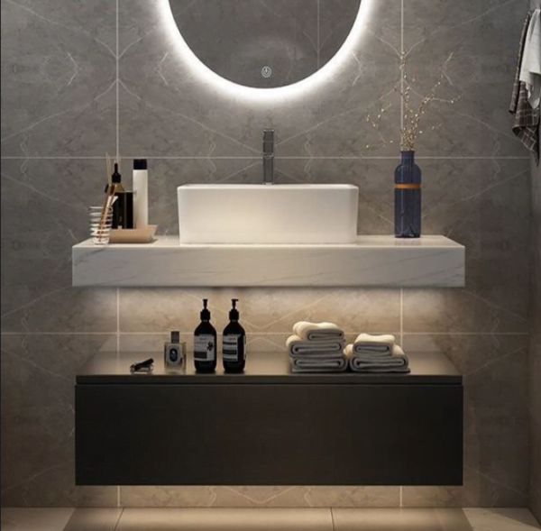 custom floating bathroom vanity with open drawer, quartz countertop, and under-cabinet lighting in a modern bathroom