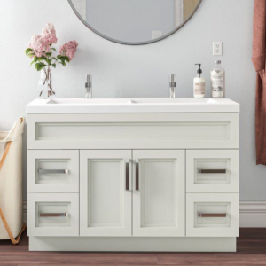 A freestanding double sink vanity with a modern design, featuring white cabinetry and sleek hardware, placed against a light-colored wall.