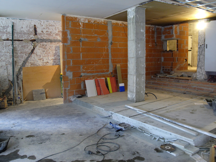 Home interior demolition in progress, showing the structural changes and impact on home renovation cost.